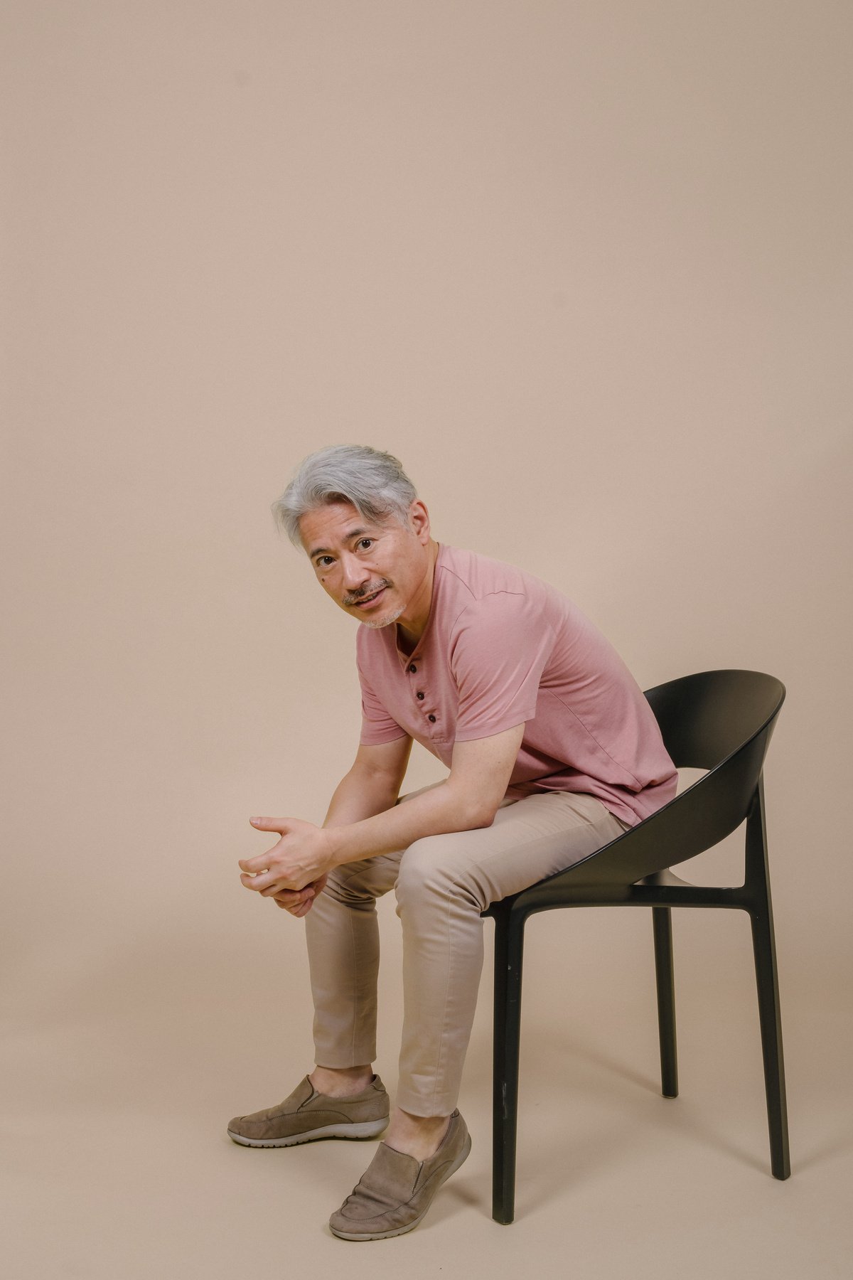 Studio Portrait of a Japanese Man Sitting